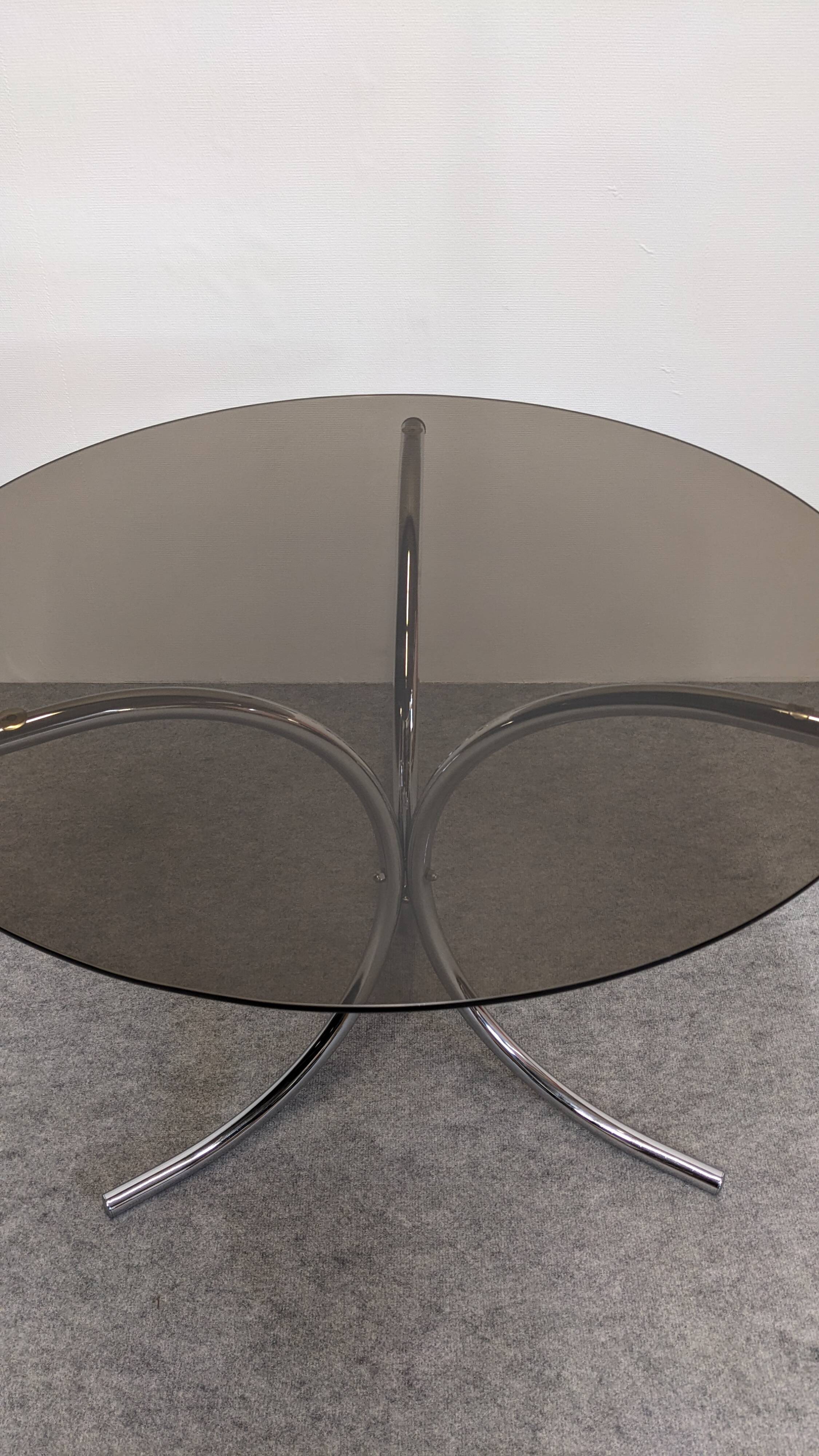 Chrome metal and smoked glass round table, Italy circa 1970.