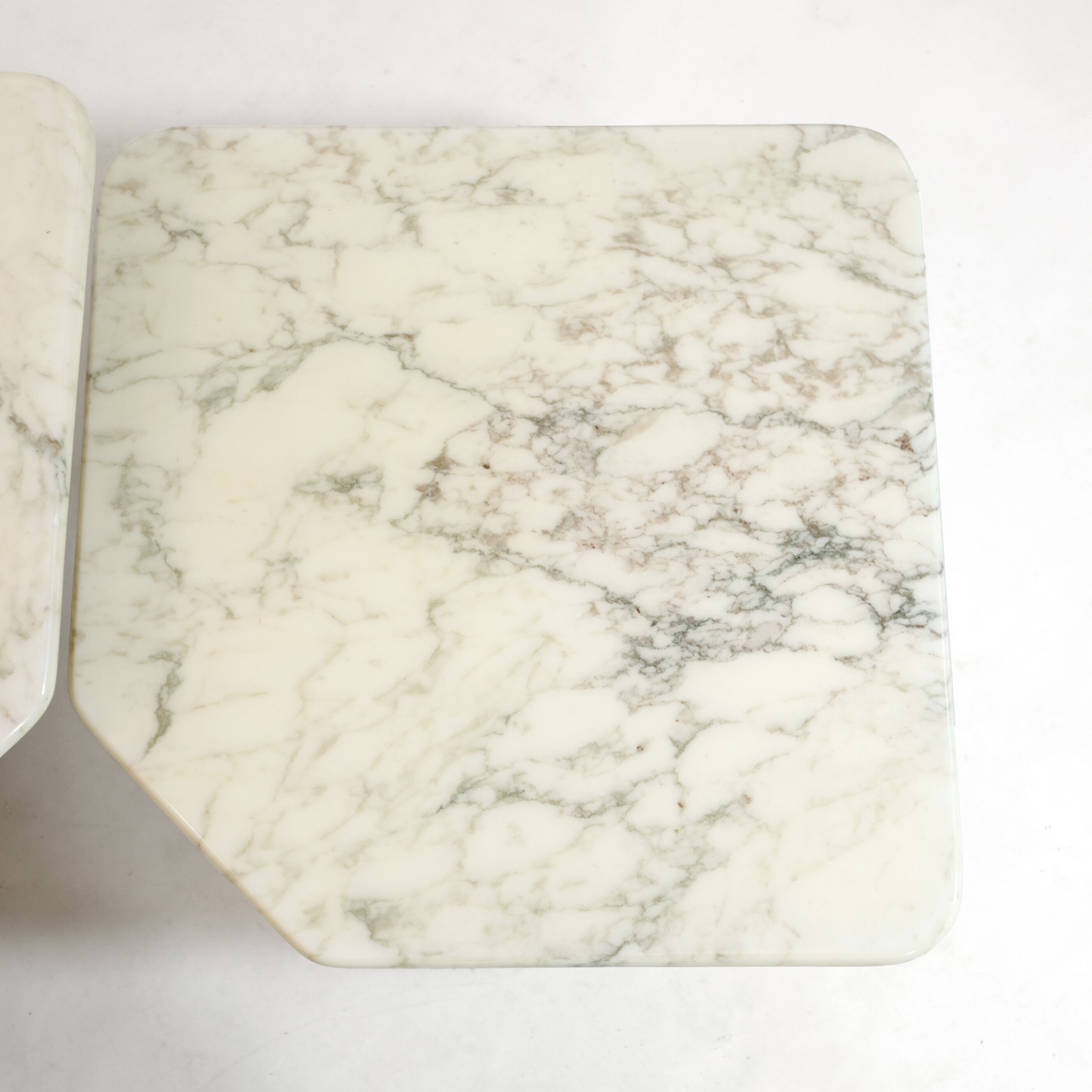 Suite of three marble trundle tables, 1970s