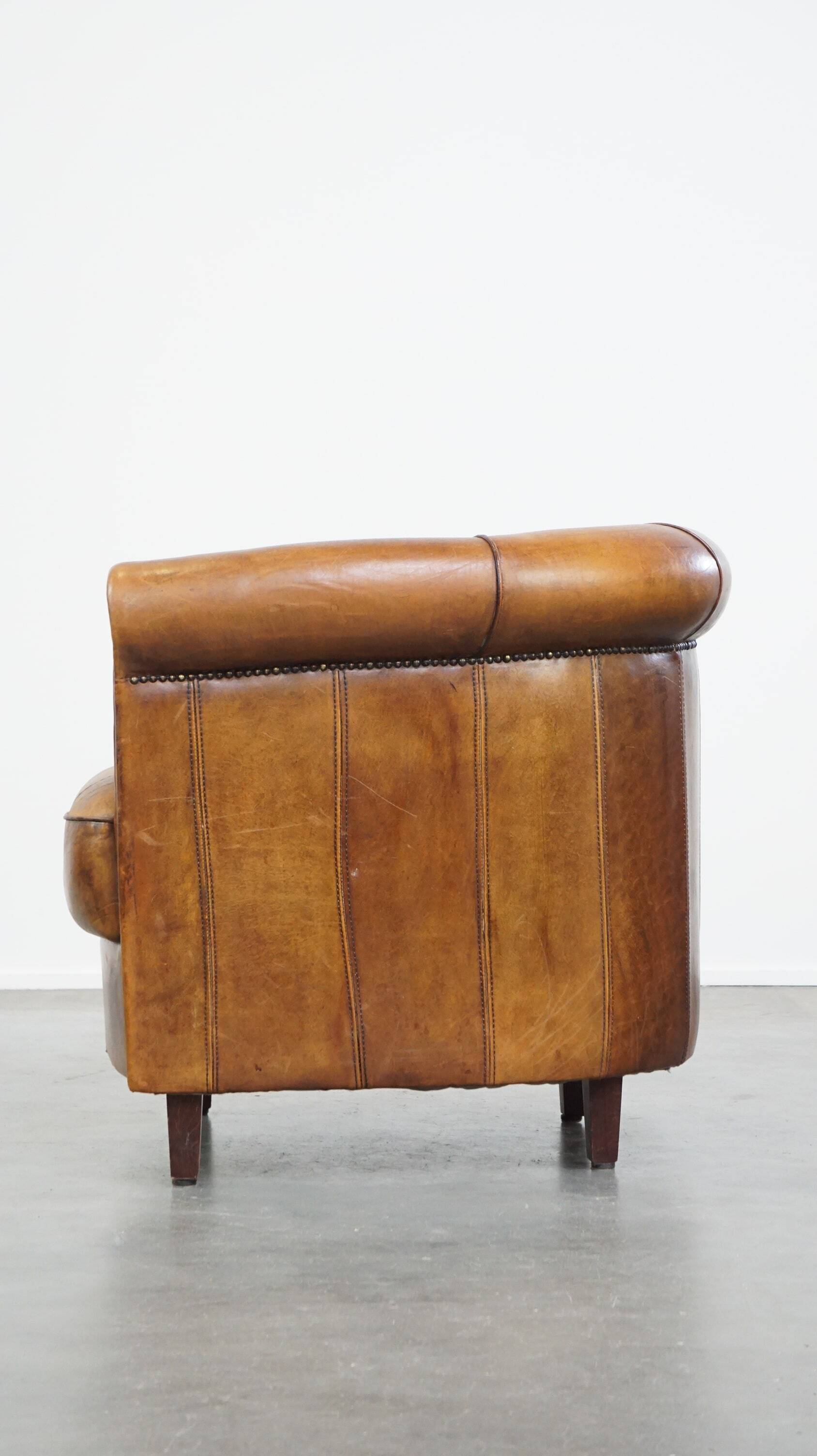 Brown leather club chair