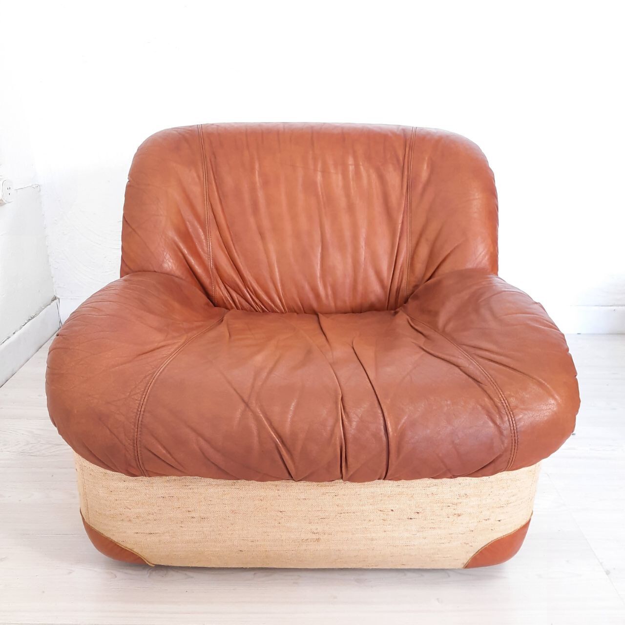 Four vintage armchairs, leather and fabric, 70s