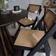 4 folding chairs in rattan and black wood by H&M