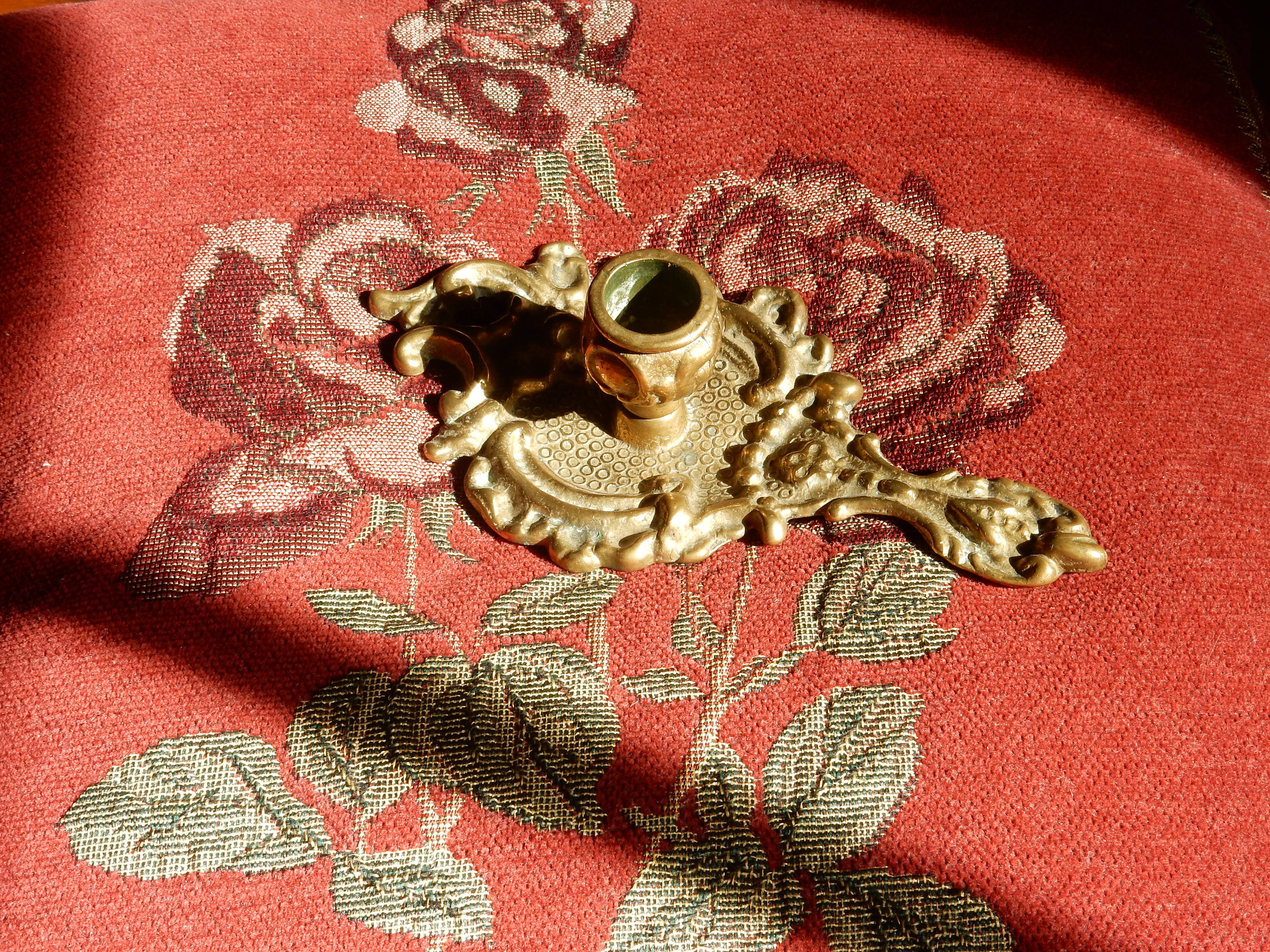 Bronze hand candle holder, cellar rat