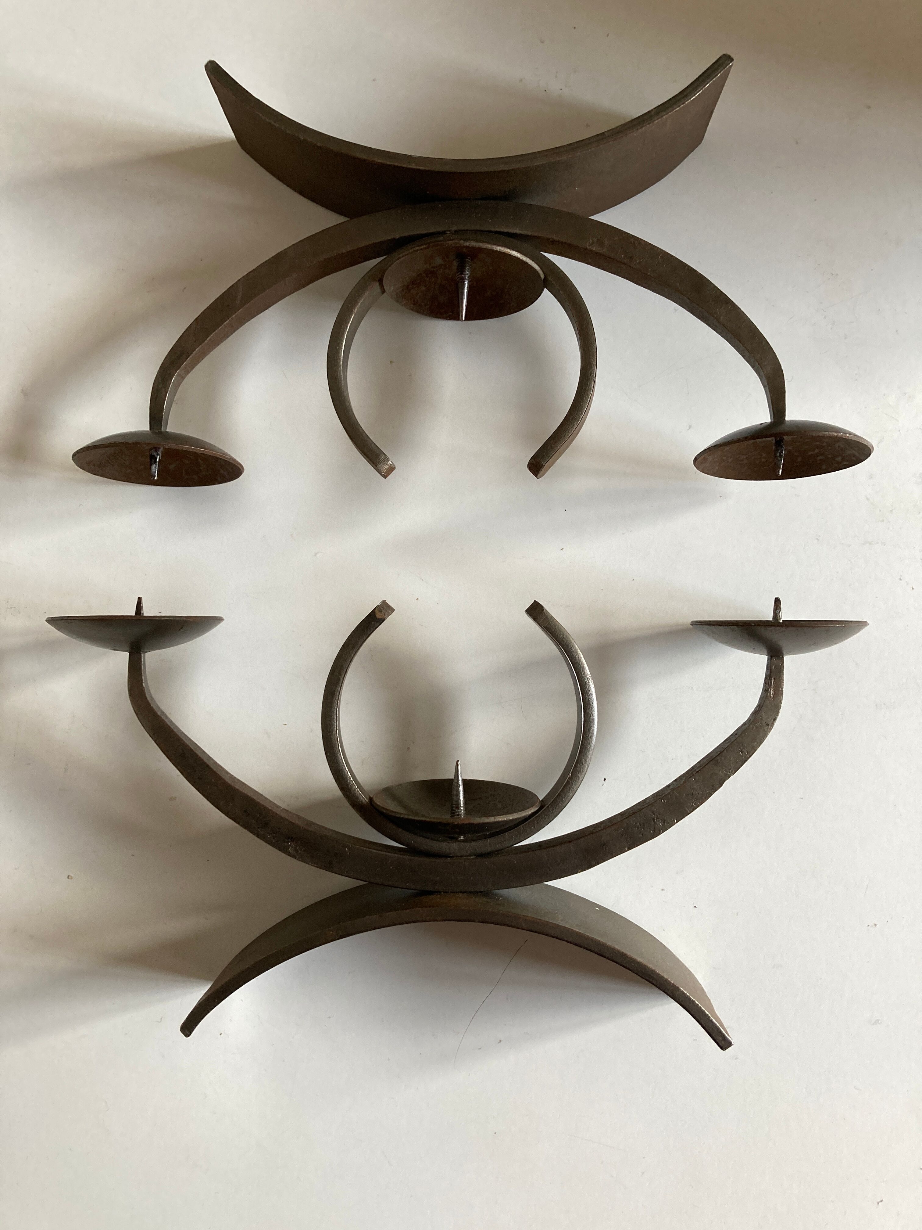 Pair of modernist candlesticks in beaten iron 1970
