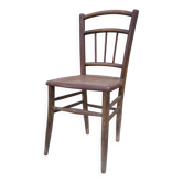 Chair with a slatted backrest and caned seat.