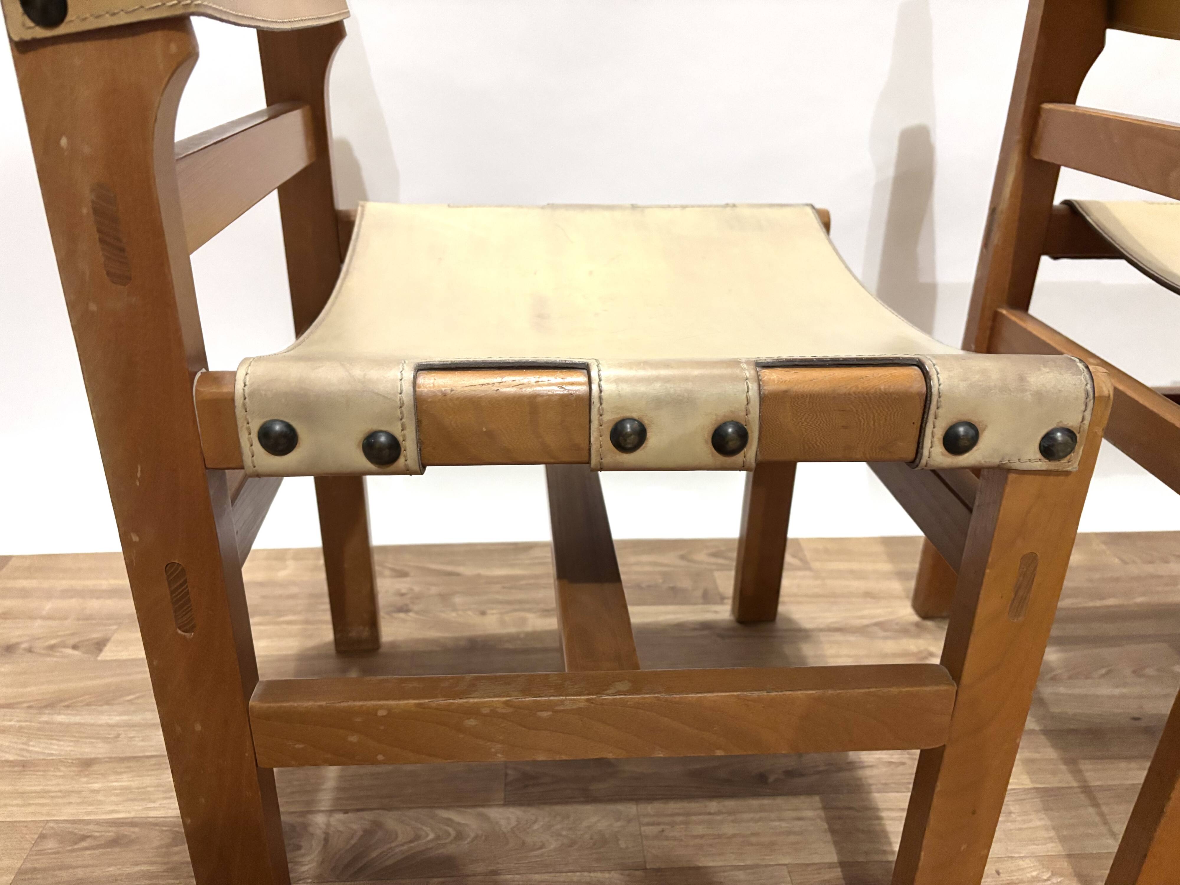 Pair of Maison Regain leather chairs