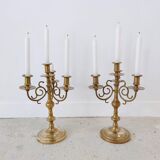 Pair of four-light candle holders in gilded brass
