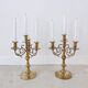 Pair of four-light candle holders in gilded brass