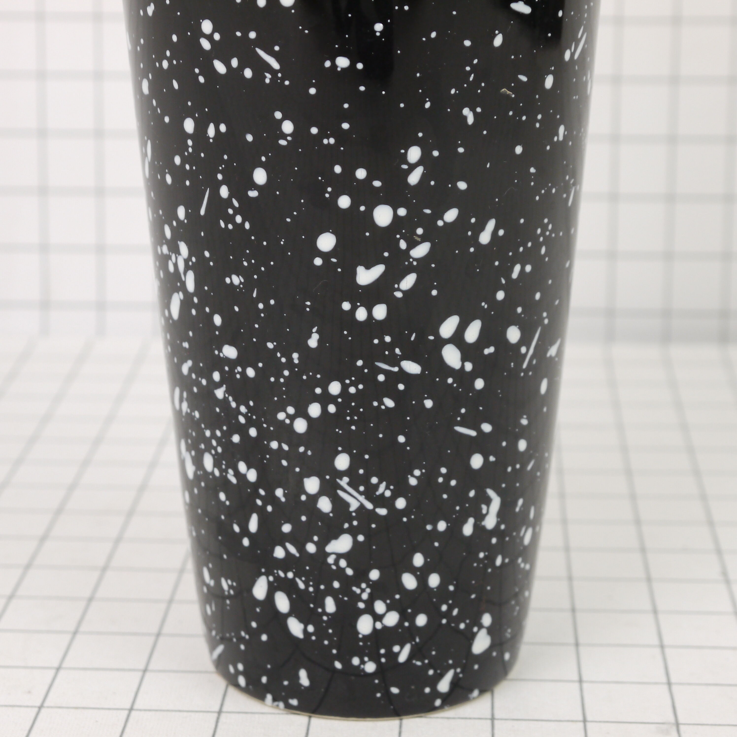 Black and white speckled vase