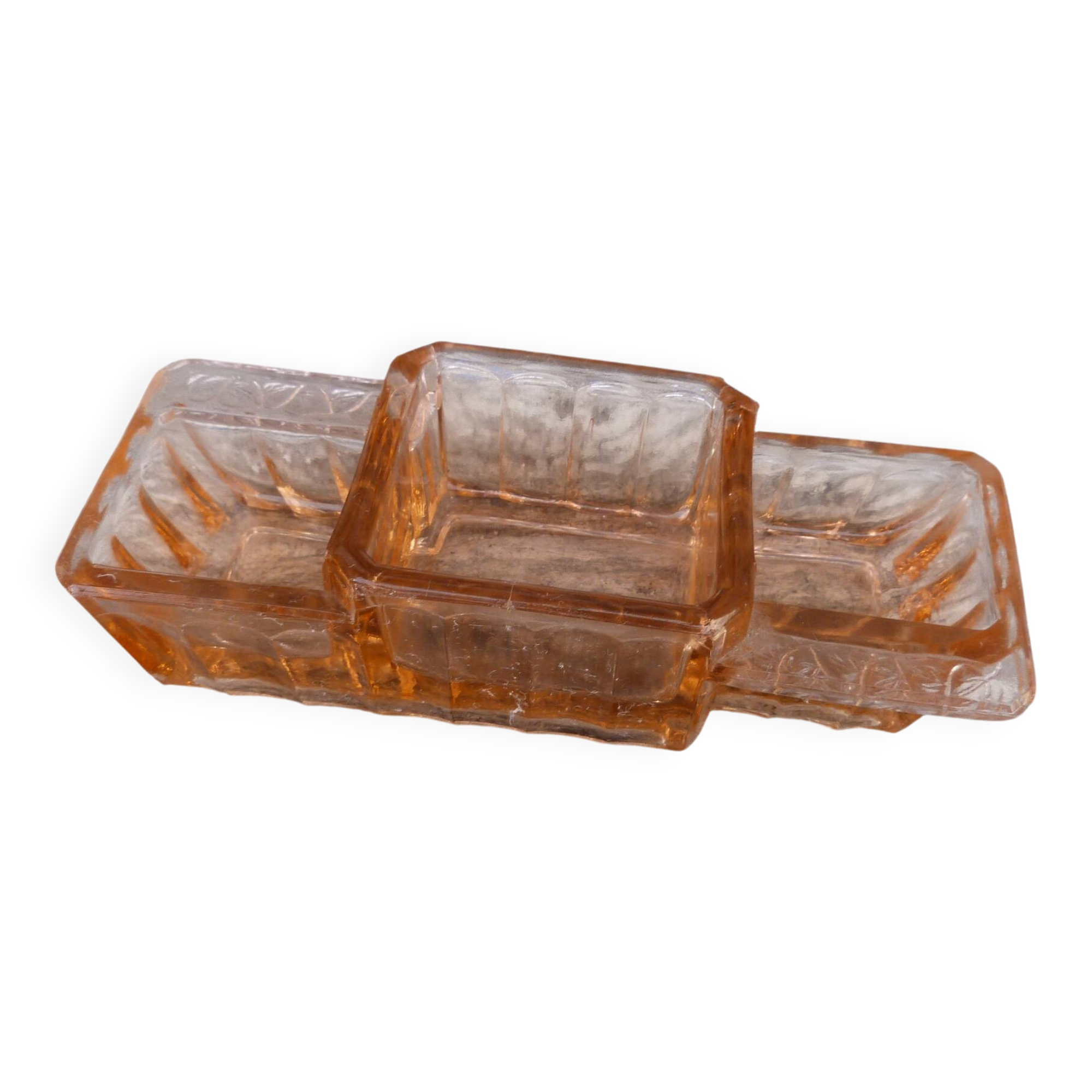 Glass condiment service in transparent pink moulded glass.