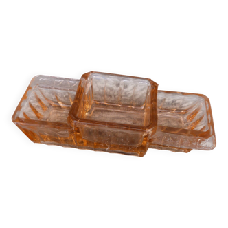 Glass condiment service in transparent pink moulded glass.