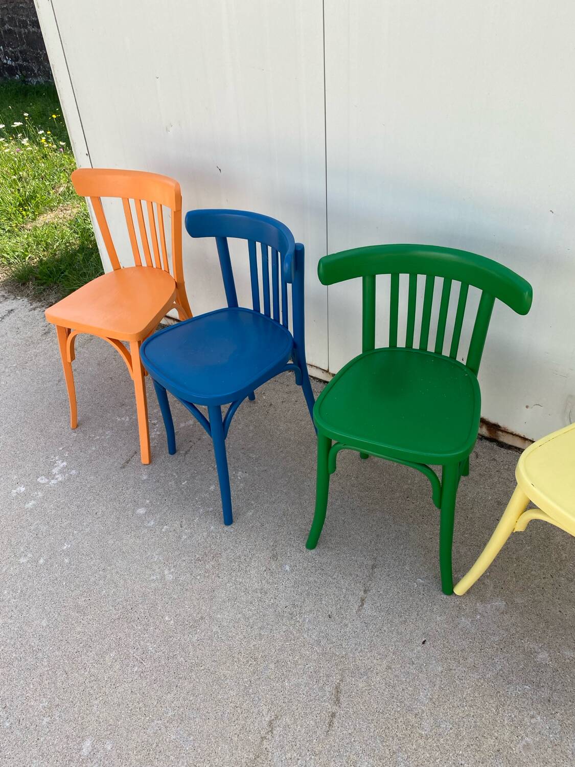 4 multi-colored bistro chairs