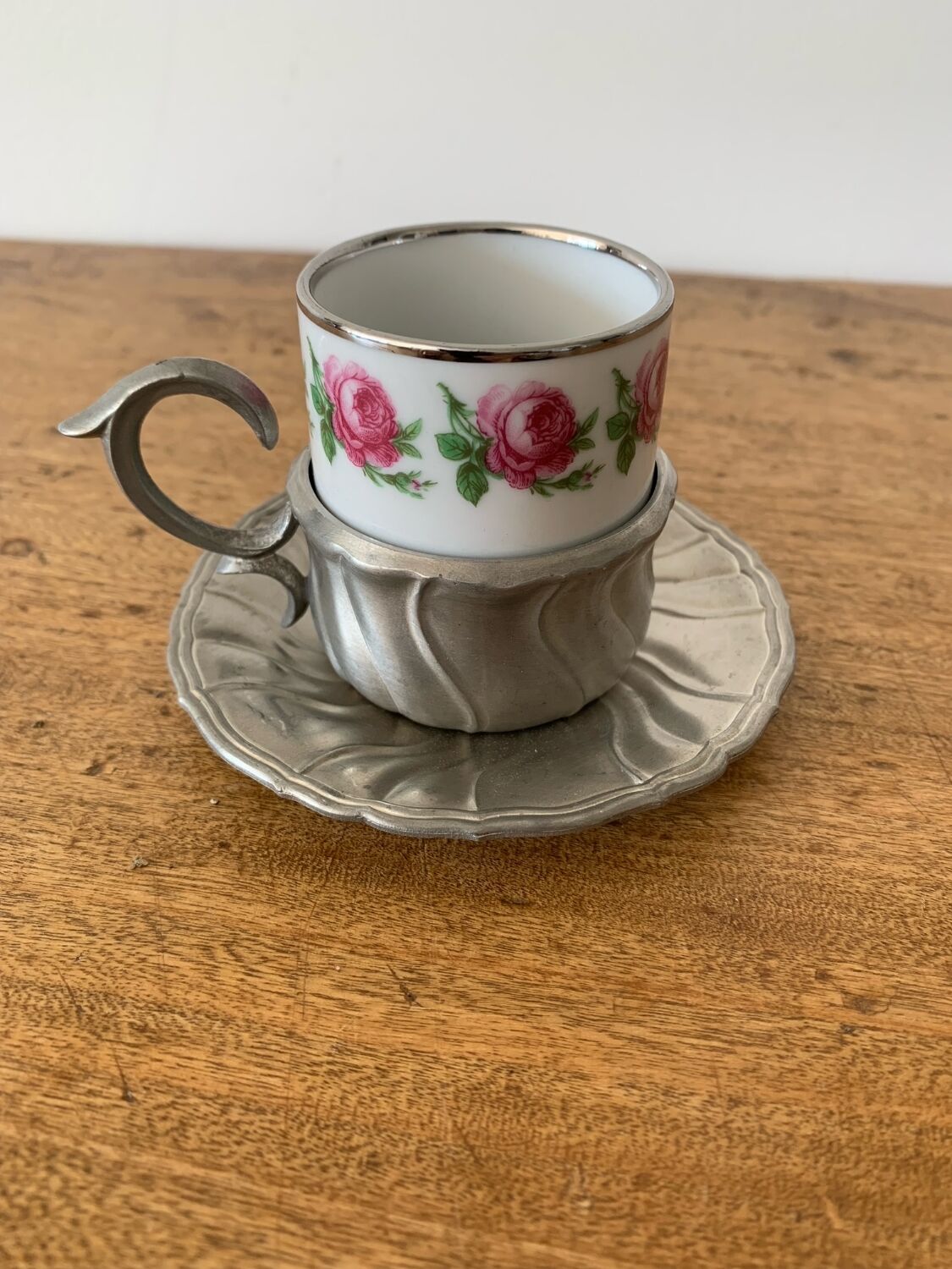 2 small porcelain cups and their pewter cup holders