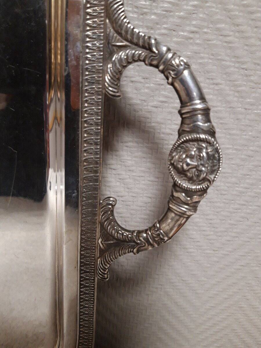 Silver-plated service tray with handles, neoclassical decoration.