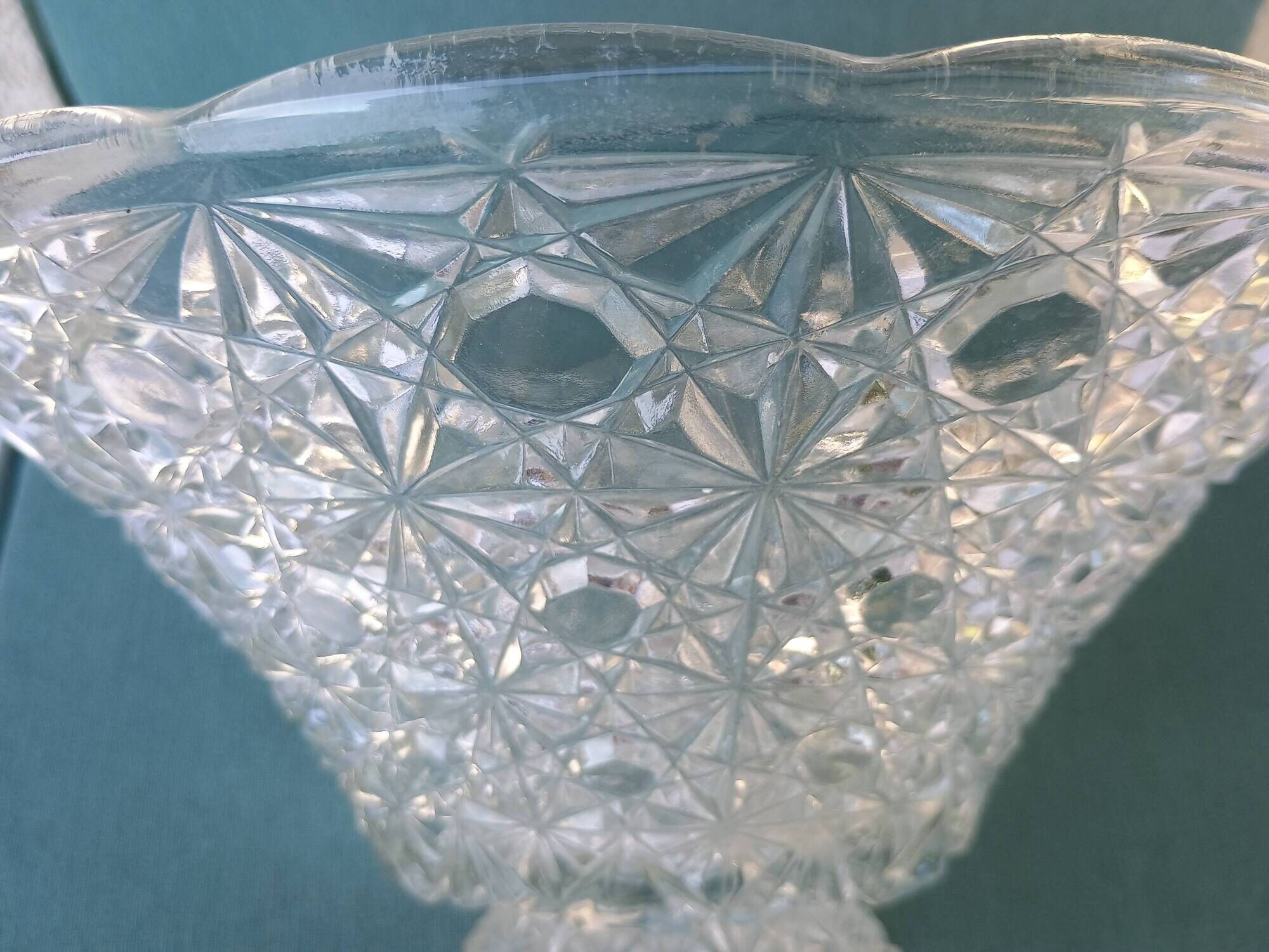 Flared fruit bowl with a pedestal, all made of pressed moulded glass, mid-20th century.