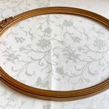 Oval frame with gilded pediments 19th wood and stucco