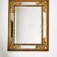 Grand miroir italien doré en bois à verre biseauté