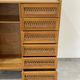 Children's wardrobe in wood and rattan with so-called Parisian compass feet