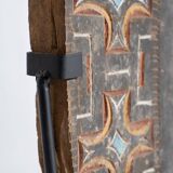 Indonesian construction element in carved wood with cross pattern in red, white geometric frieze