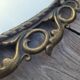 2 antique oval mirrors in heavy metal
