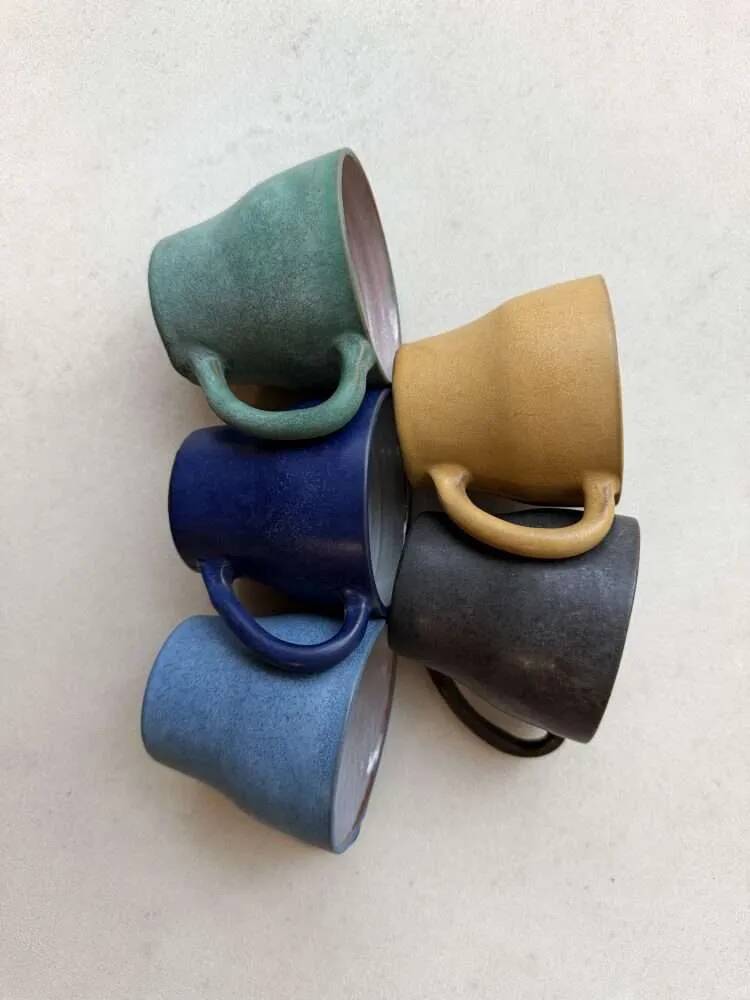 Set of five mugs from a 1960s Scandinavian studio.