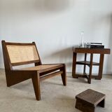 Reclined armchair in canned teak in natural wood