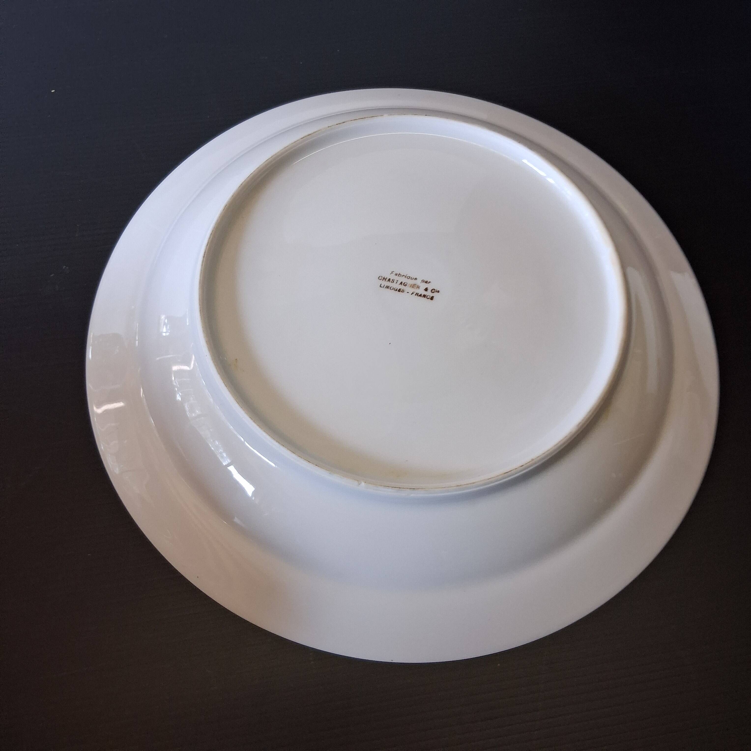 Round hollow serving plate in porcelain from Chastagner et Cie in good condition.