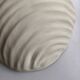 Shell-shaped ceramic applique handcrafted.