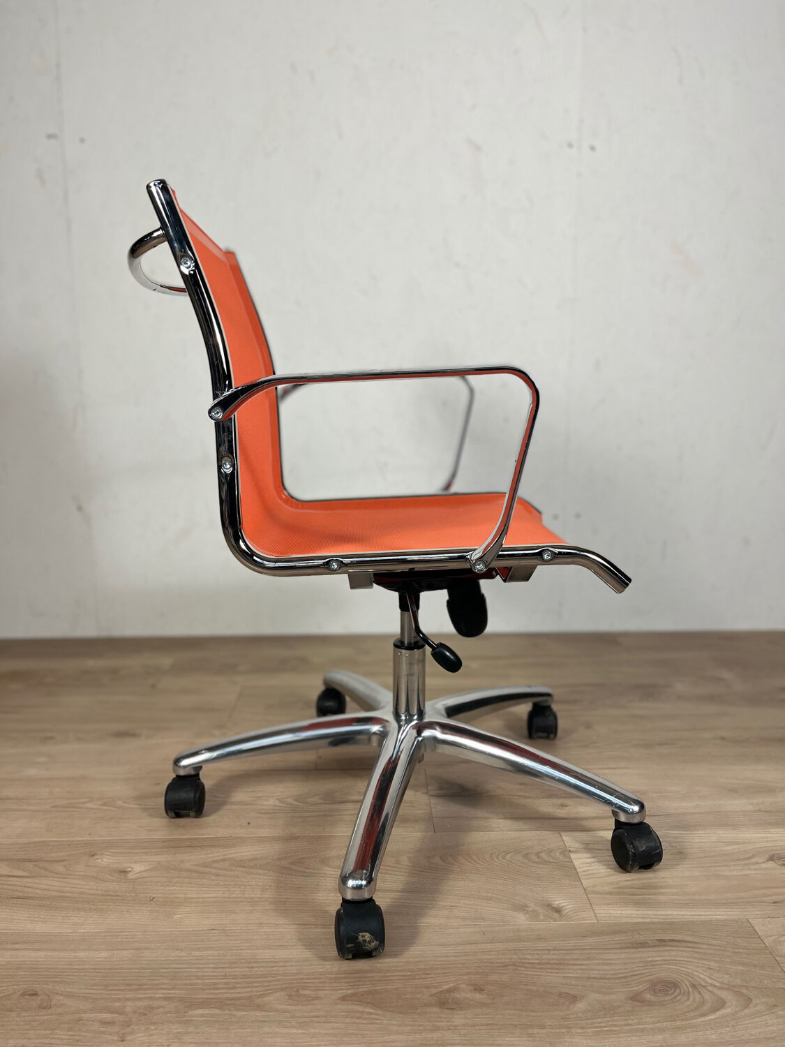Designer office chair - Orange mesh and chrome base