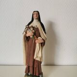 religious statue of Saint Therese of Lisieux in painted plaster