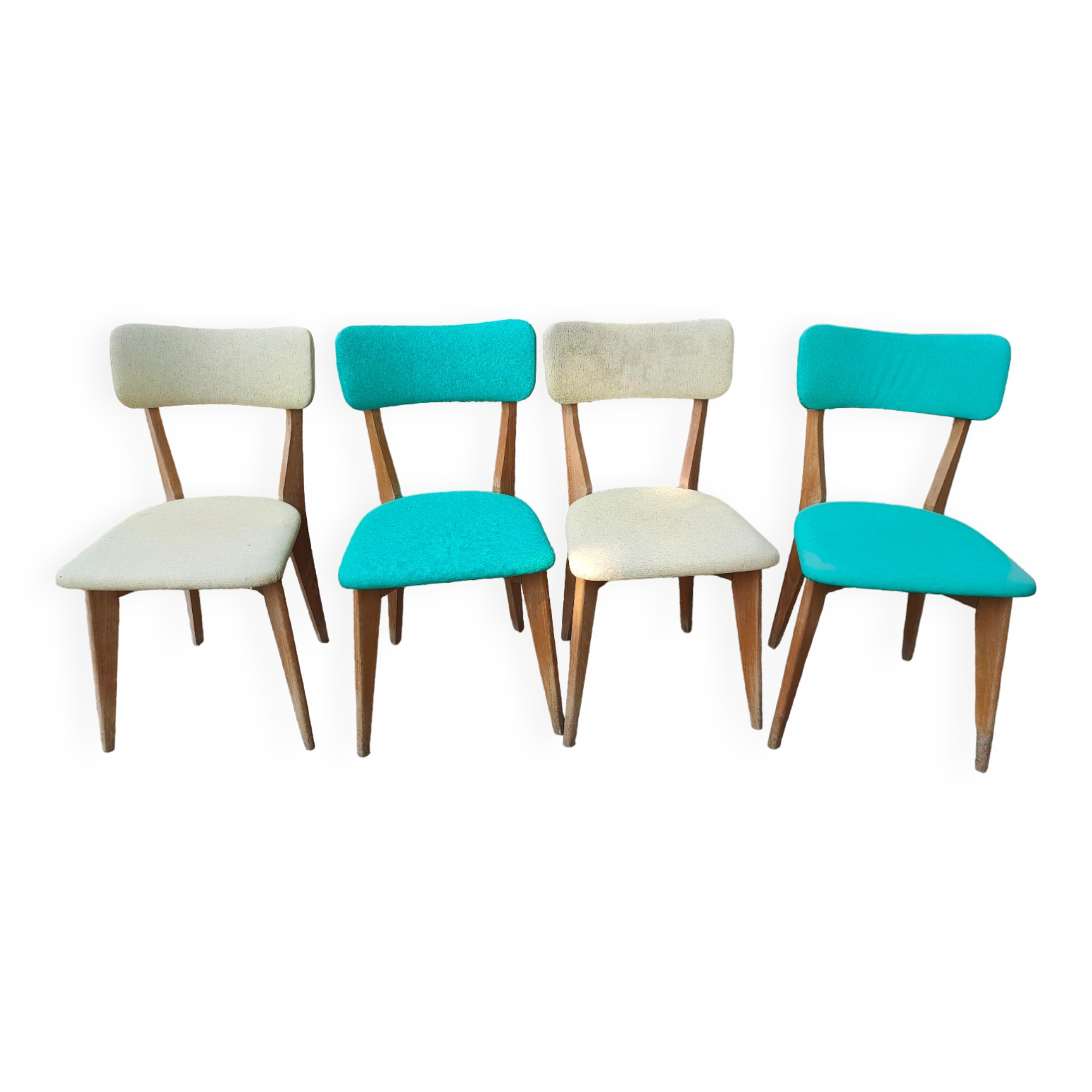 Set of 4 vintage chairs in wood and imitation blue leather dating from the 50s. Wooden structure. Seat and backrest in imitation leather 2 mint green and 2 yellow. Seating dimension: 46 cm. Good state of conservation, some traces of wear.