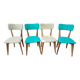 Set of 4 vintage chairs in wood and imitation blue leather dating from the 50s. Wooden structure. Seat and backrest in imitation leather 2 mint green and 2 yellow. Seating dimension: 46 cm. Good state of conservation, some traces of wear.
