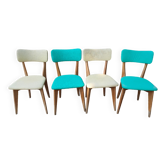 Set of 4 vintage chairs in wood and imitation blue leather dating from the 50s. Wooden structure. Seat and backrest in imitation leather 2 mint green and 2 yellow. Seating dimension: 46 cm. Good state of conservation, some traces of wear.