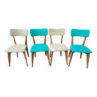 Set of 4 vintage chairs in wood and imitation blue leather dating from the 50s. Wooden structure. Seat and backrest in imitation leather 2 mint green and 2 yellow. Seating dimension: 46 cm. Good state of conservation, some traces of wear.