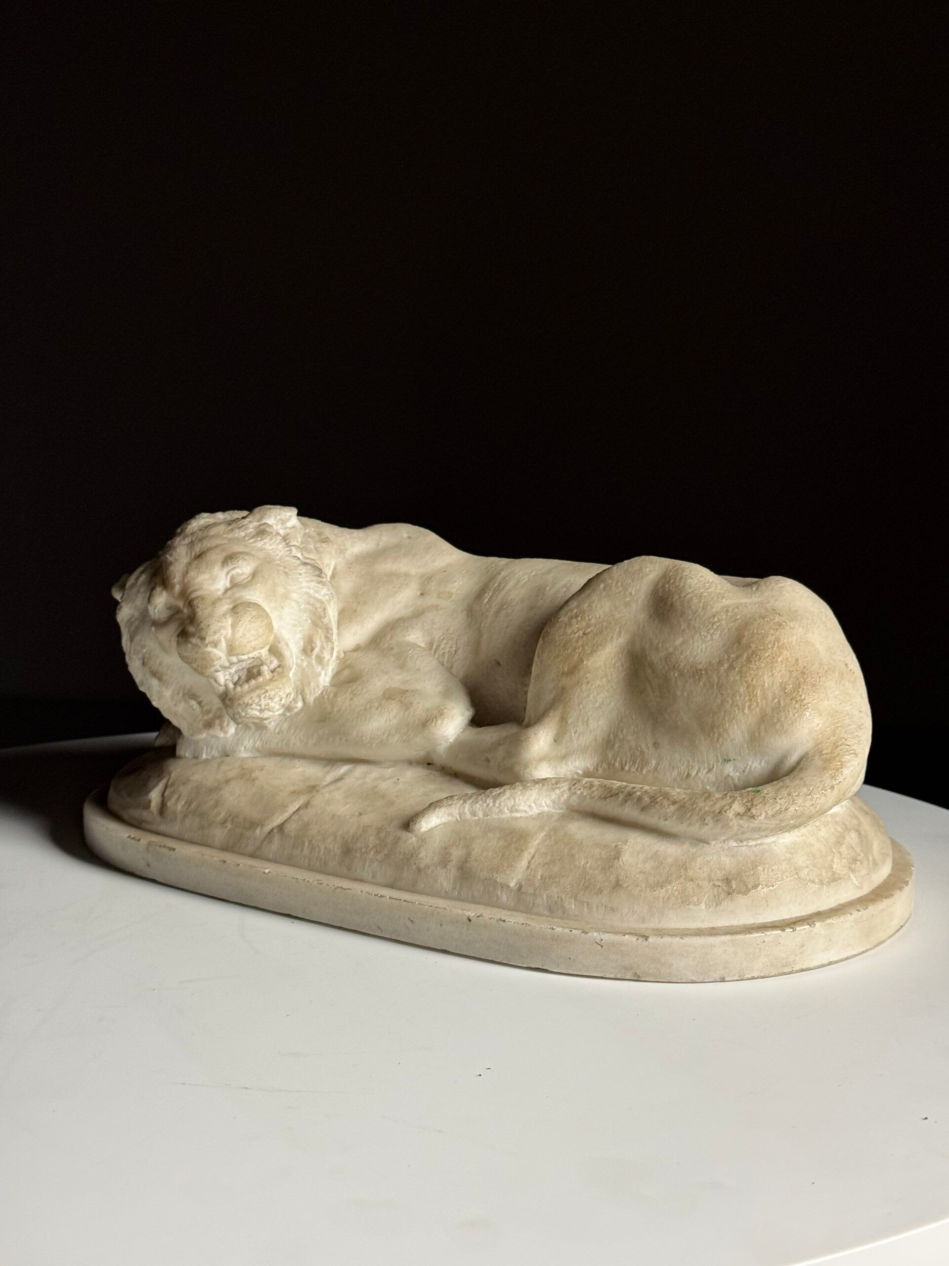 Marble sculpture of a reclining lion