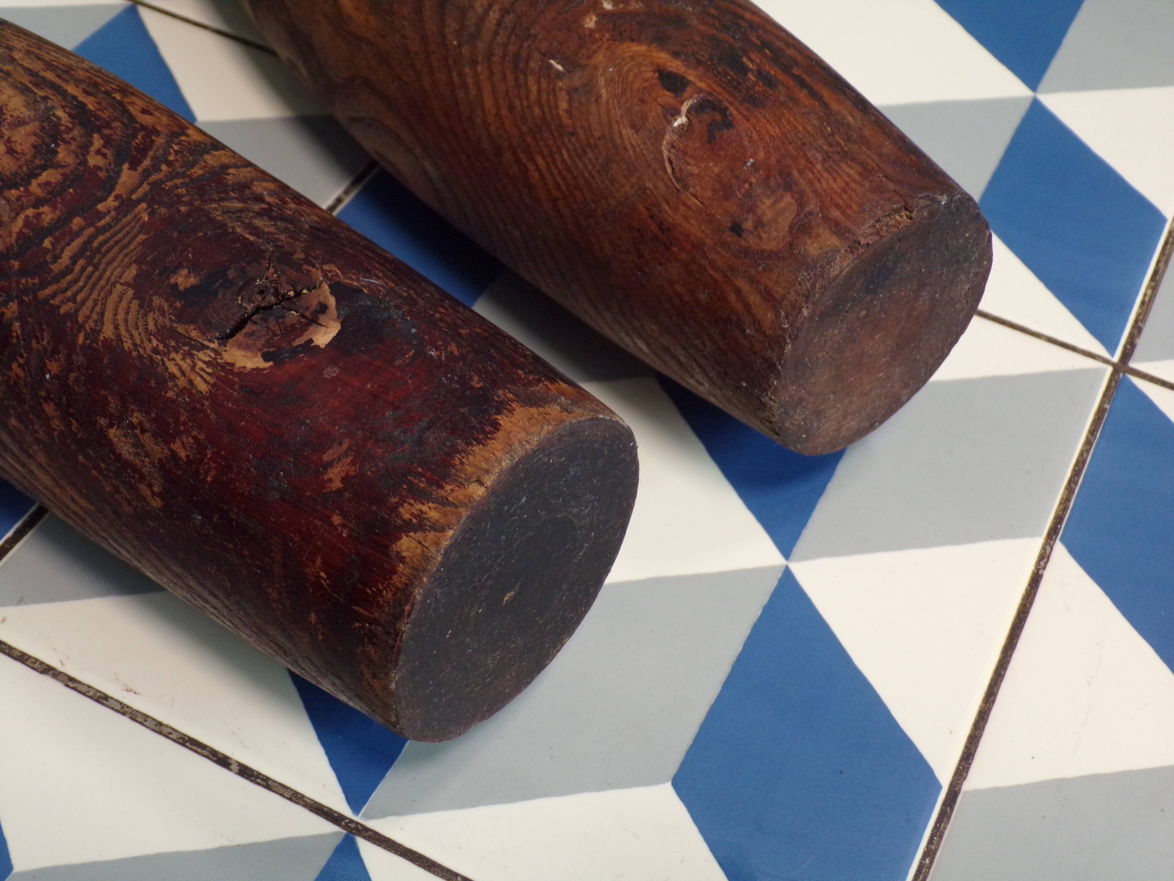 2 old wooden juggling clubs