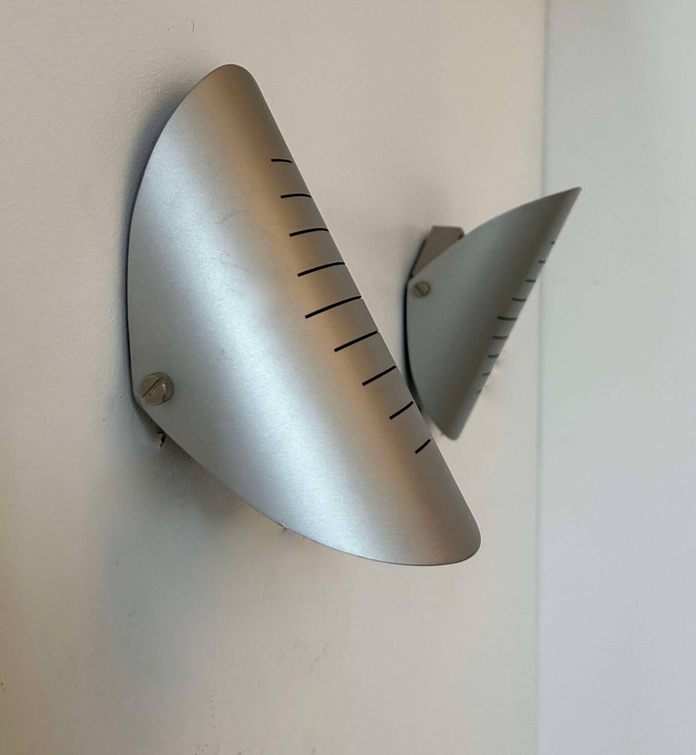 Pair of vintage adjustable wall lights, curved striated metal, France 1980