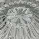Molded glass ceiling light with spinning top relief