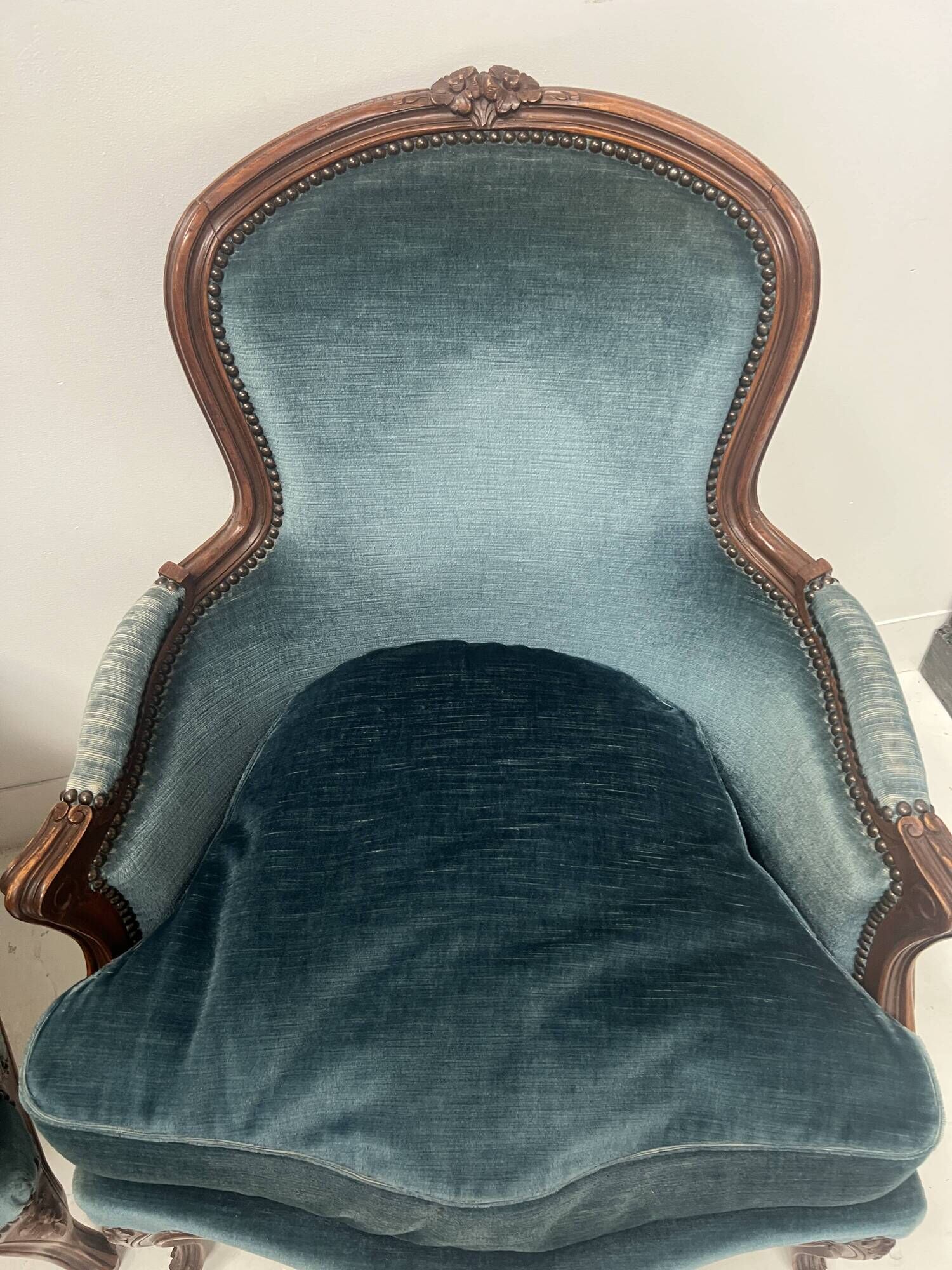 Pair of Louis XV style armchairs in natural wood, 20th century.