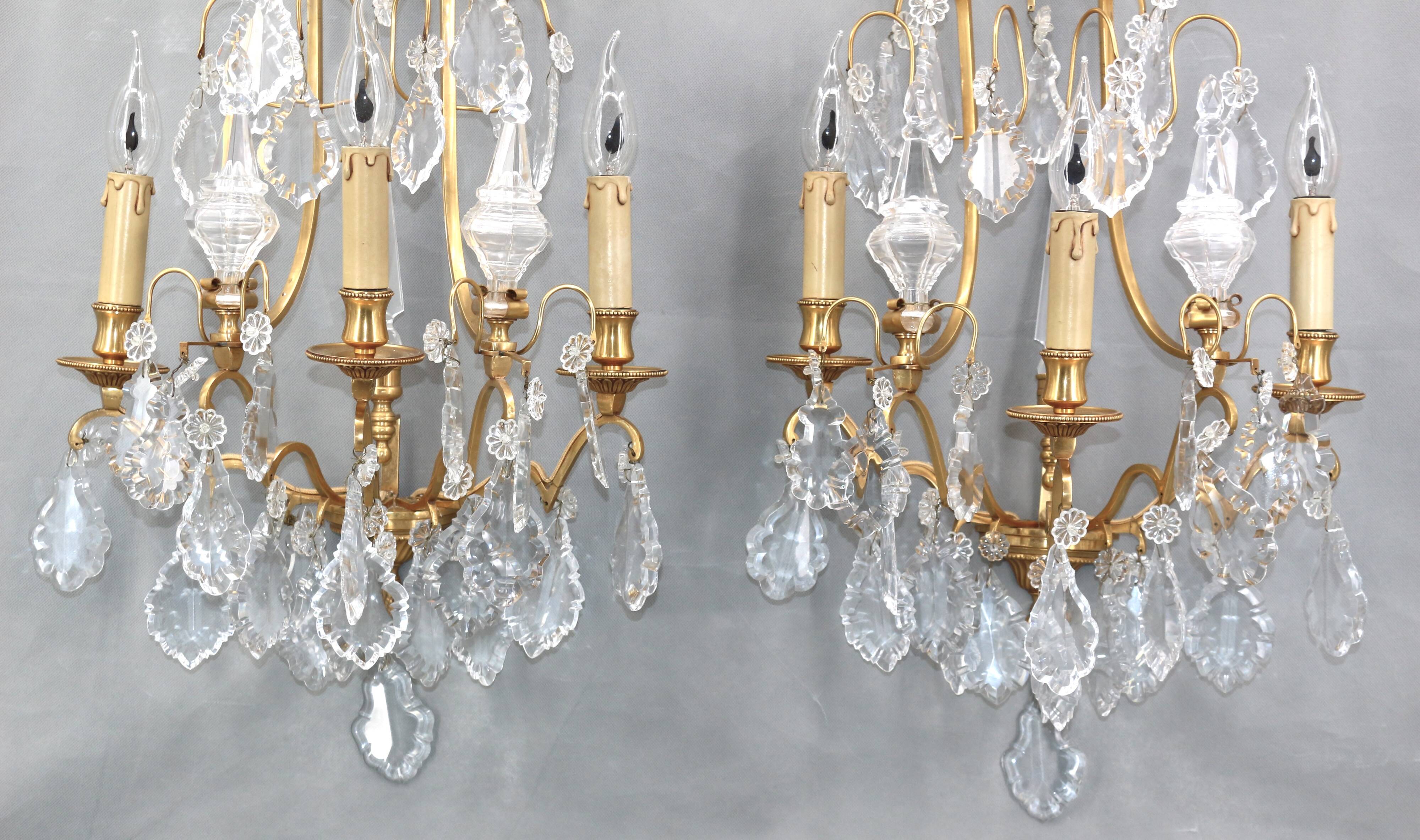 Pair of Louis XVI style gilded bronze & bohemian crystal sconces