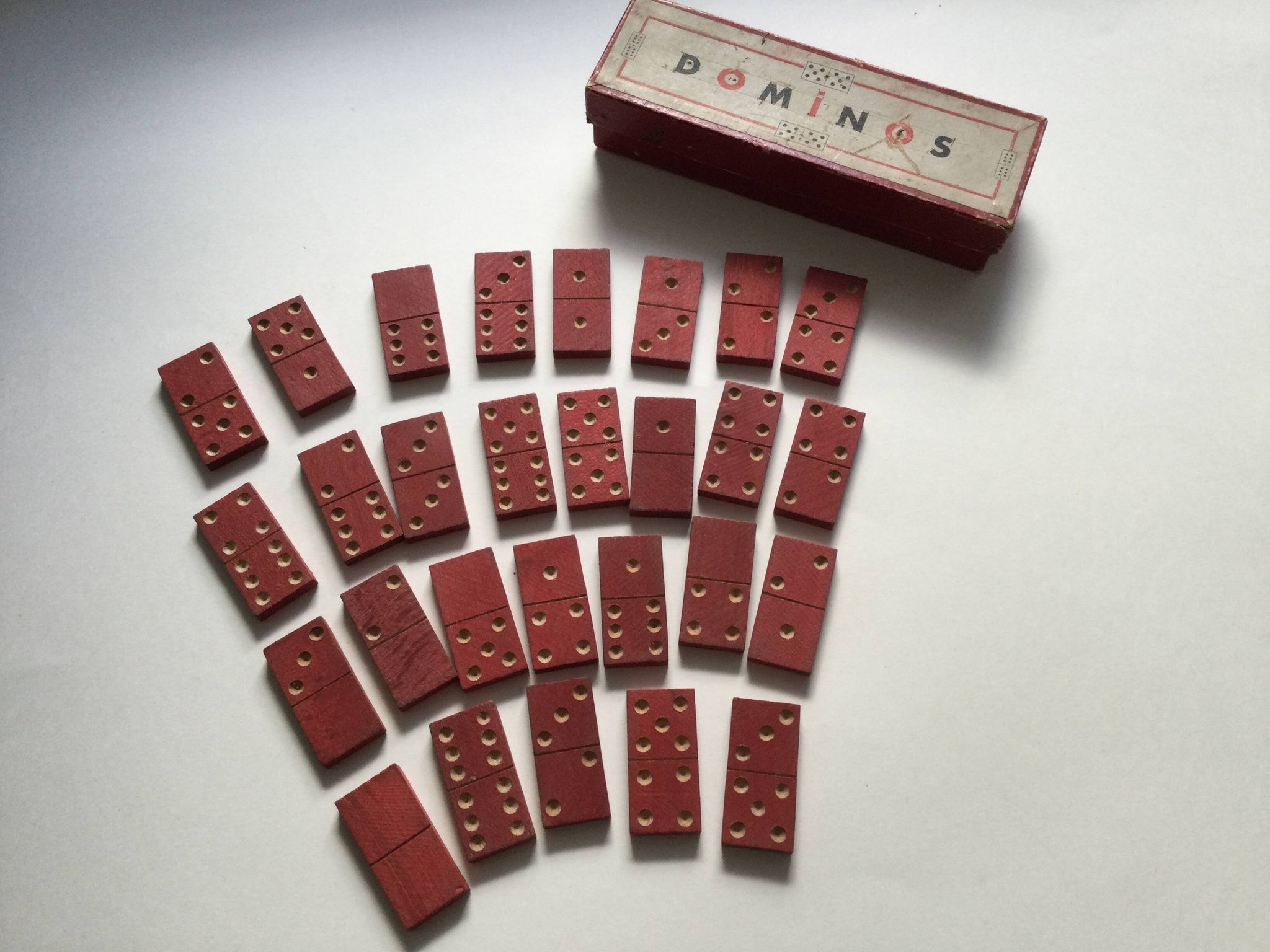 Red wooden dominoes game from the 50s old toy