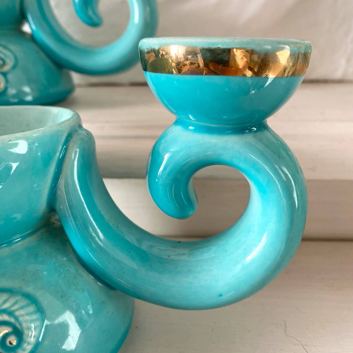Pair of turquoise and gold double candlesticks