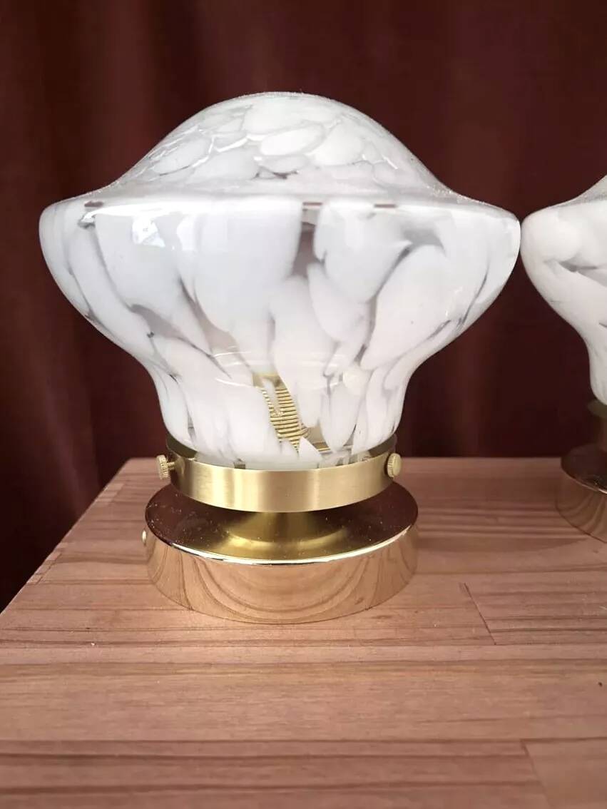 Pair of white globe wall lights