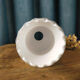 White opaline shaped like a lily of the valley bell