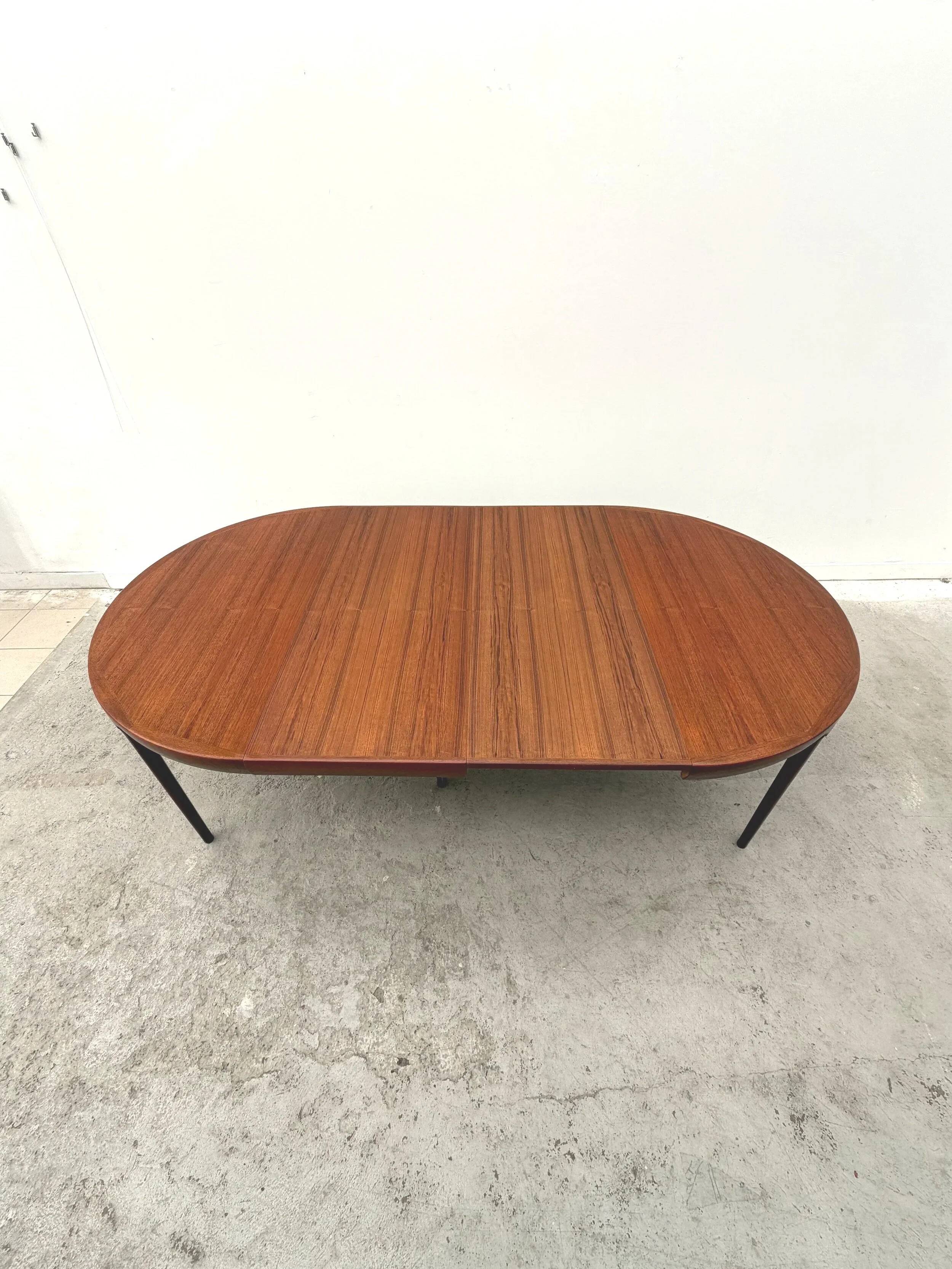 Dining table by Kofod Larsen for Faarup Mobelfabrik in teak, Denmark 1960.