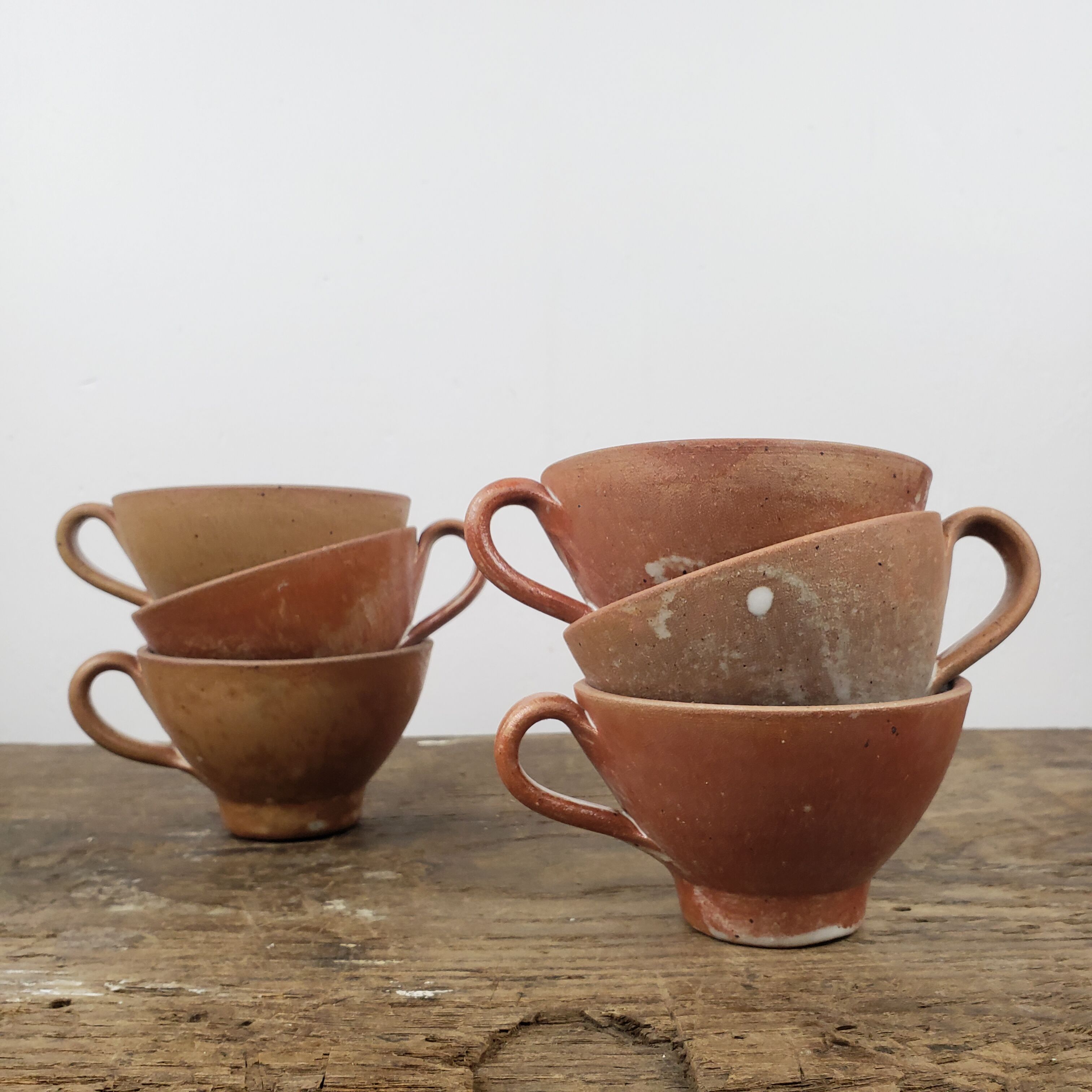"Bowled" stoneware cups
