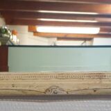 Beveled mirror in carved wood