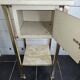 Bedside table in patinated iron, brass and marble tops