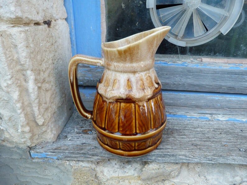 Former wine pitcher in glazed earth style bistrot auberge