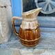 Former wine pitcher in glazed earth style bistrot auberge