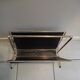 Magazine holder patinated golden metal skaï black